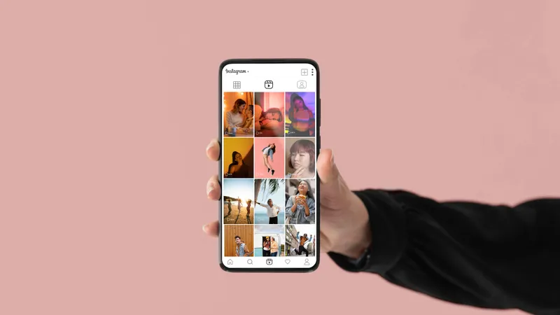 Close-up of a hand holding a phone with an Instagram account open
