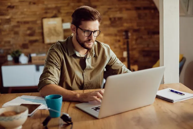 man deleting a comment on Instagram using a laptop man deleting a comment on Instagram using a laptop