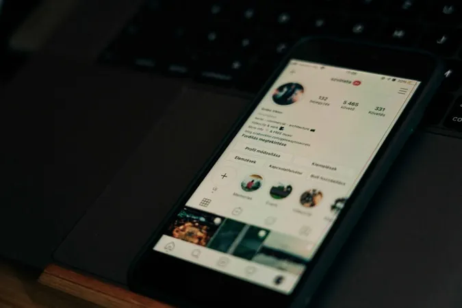 he phone screen displaying an Instagram profile he phone screen displaying an Instagram profile