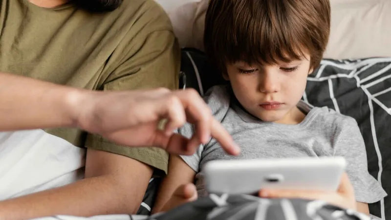 Father and son use tablet
